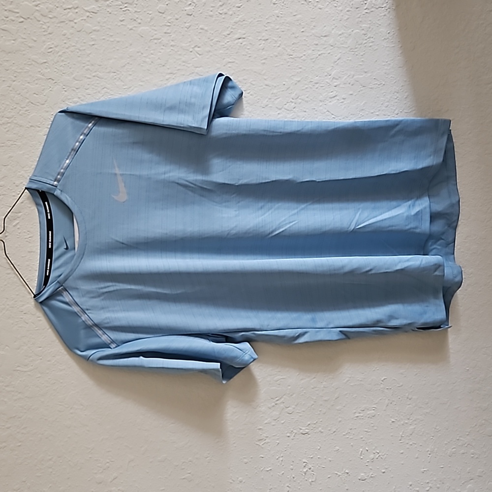 Nike Running t-Shirt baby blue. Never worn as it makes my partner look pale.
